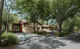 Vista externa ampla do edifício entre árvores