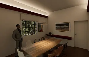 Vista interna de sala de reunião. Mesa retangular de madeira ao centro com cadeiras ao redor.